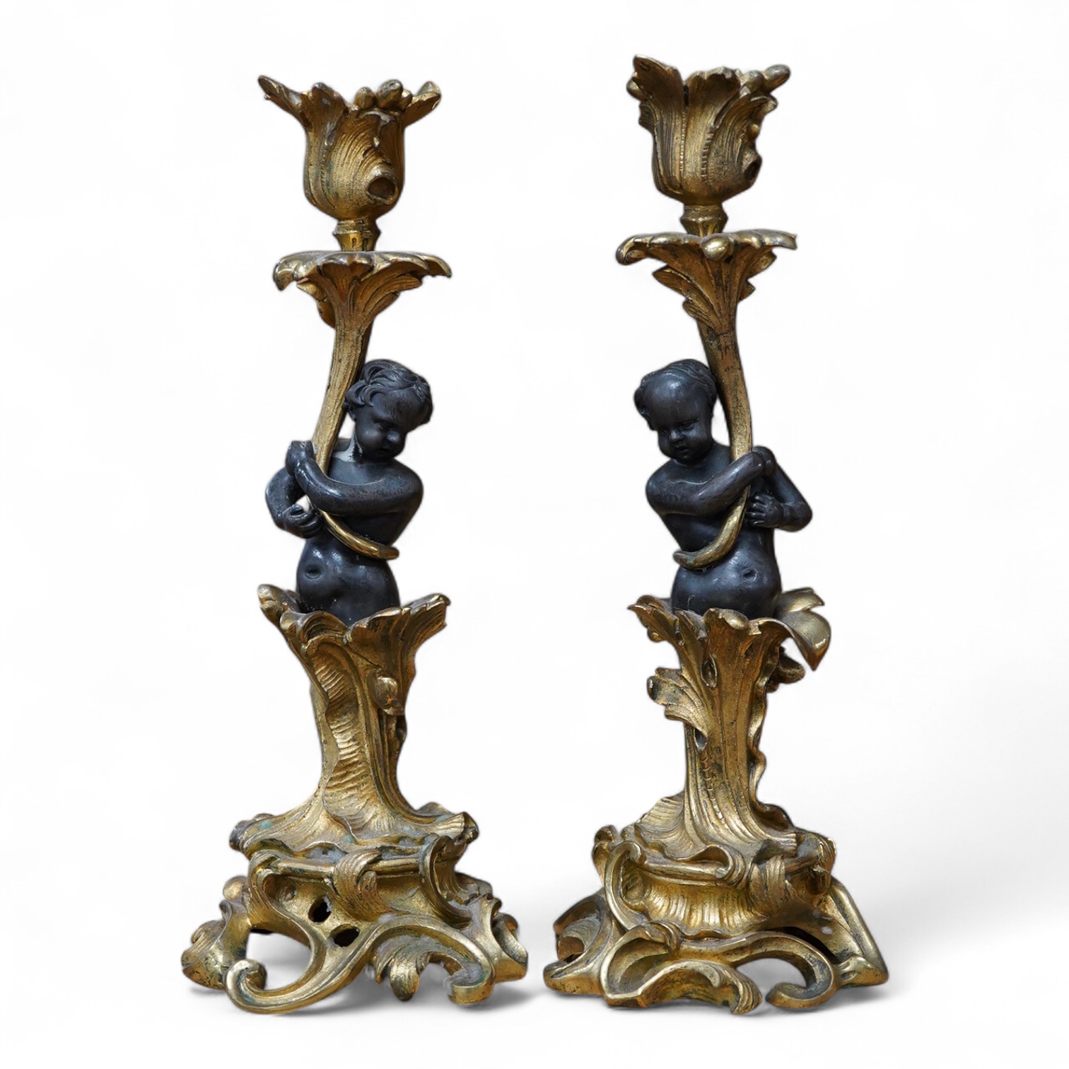 A pair of decorative French ormolu figural candlesticks, 25.5cm high